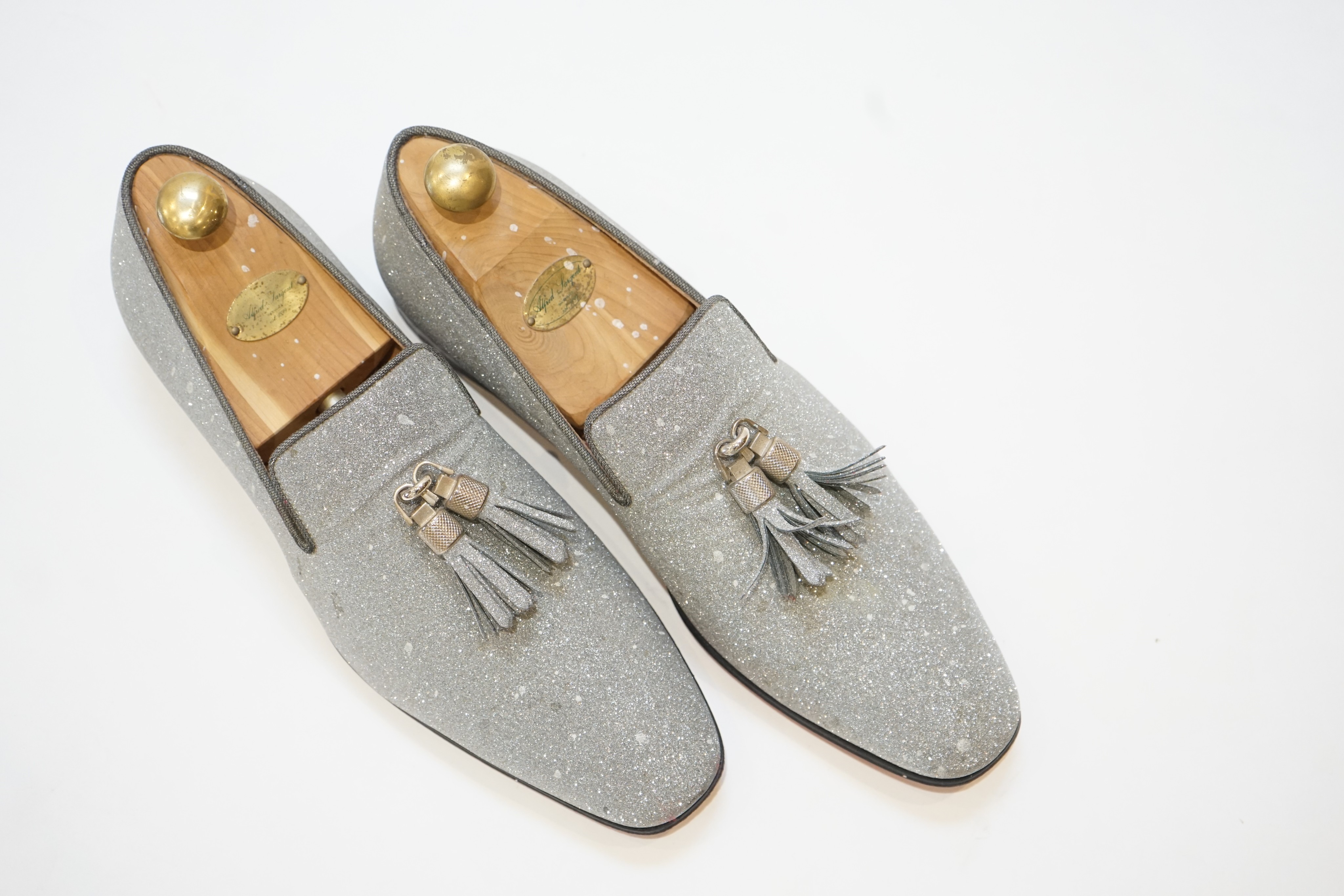 A pair of gentleman's Christian Louboutin silver glitter tasselled loafers, in shoe bag, size 42.5